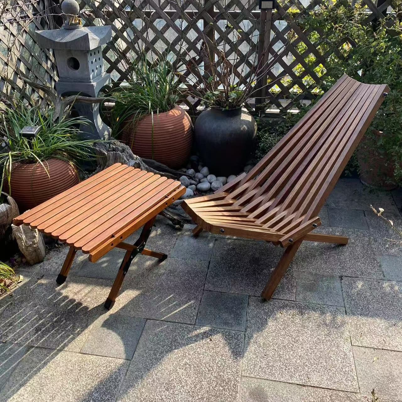 Bamboo lounge chair and side table in a garden