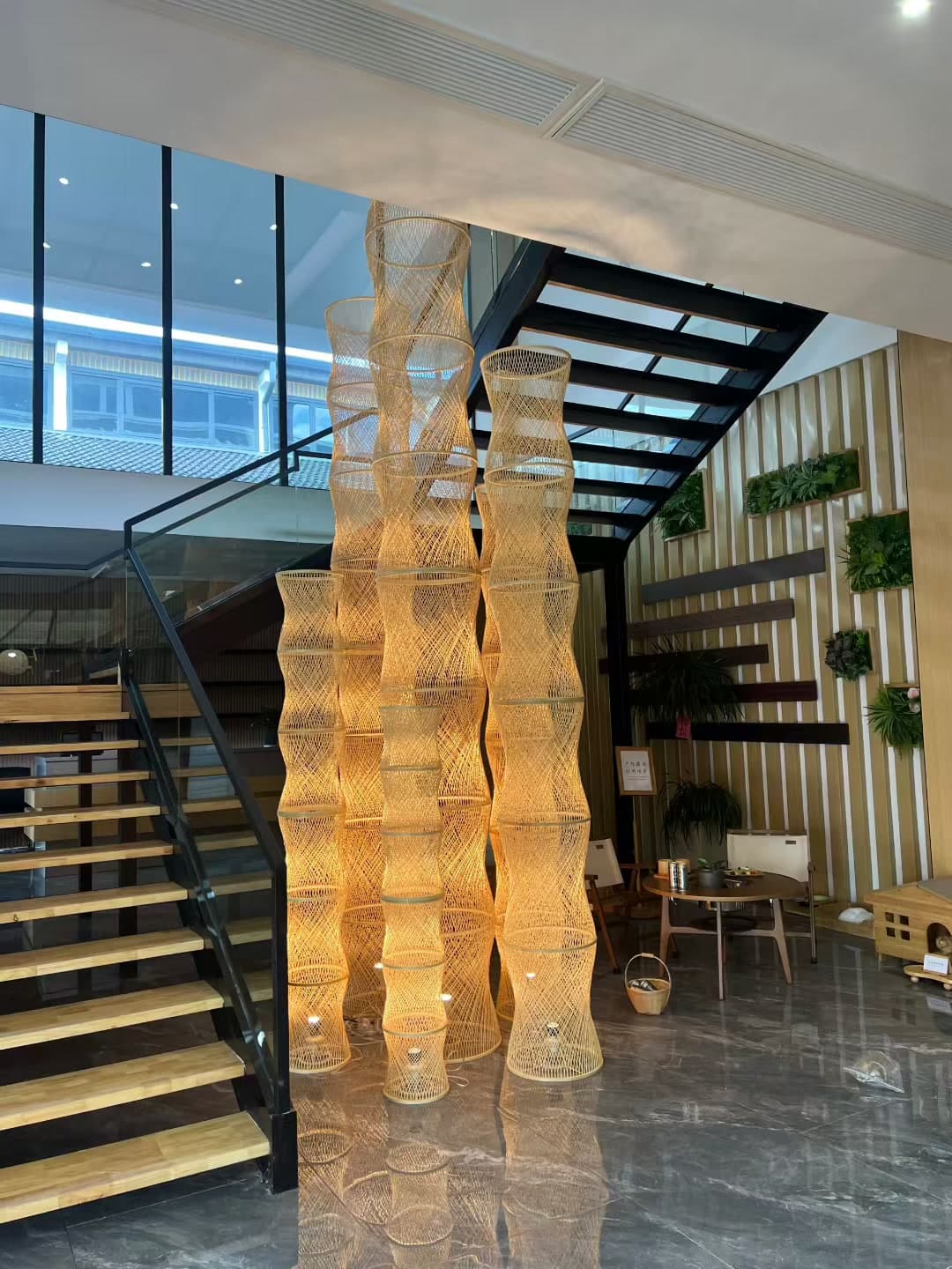 Custom bamboo lighting installation by a stairwell